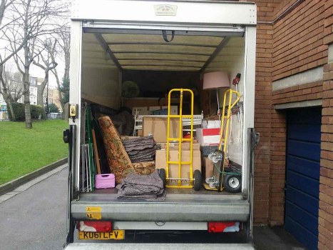 Man and van loading bulky items at a Dockyard industrial unit in Woolwich